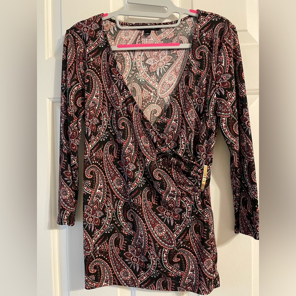 Medium weight snug fit blouse. I’m a size 6 and 5’4”.